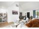 Bright living room with modern furnishings, statement artwork, and large windows at 521 W Cambridge Ave, Phoenix, AZ 85003