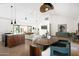Open floor plan with dining area, modern kitchen island, and a comfortable living space at 521 W Cambridge Ave, Phoenix, AZ 85003