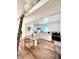 Well-lit living space featuring a modern kitchen, dining area, and stylish furnishings at 521 W Cambridge Ave, Phoenix, AZ 85003