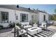 Inviting patio with modern outdoor furniture, a fire pit, and stylish striped rug at 521 W Cambridge Ave, Phoenix, AZ 85003