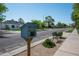 Street view with a little free library on a post, sidewalk, and greenery at 521 W Cambridge Ave, Phoenix, AZ 85003