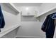 Walk-in closet with built in shelves and a closet rod at 5342 S Farmer Ave, Tempe, AZ 85283