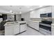 Bright kitchen features granite countertops, stainless steel appliances, and white cabinets at 5342 S Farmer Ave, Tempe, AZ 85283