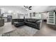 Open concept living space featuring wood-look floors and a modern kitchen island with bar seating at 5342 S Farmer Ave, Tempe, AZ 85283