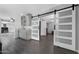 Spacious living space with bar area, leading to multiple rooms through white sliding doors at 5342 S Farmer Ave, Tempe, AZ 85283