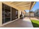 Covered patio with artificial grass and a grill at 5342 S Farmer Ave, Tempe, AZ 85283