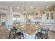 Spacious kitchen island with bar stool seating in a modern, bright kitchen at 583 E Peach Tree St, Queen Creek, AZ 85140