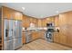 Kitchen featuring stainless steel appliances, ample cabinetry, and an efficient layout at 7254 E Vernon Ave, Scottsdale, AZ 85257