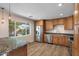 Well-lit kitchen features stainless steel appliances, granite countertops, and a view of the backyard at 7254 E Vernon Ave, Scottsdale, AZ 85257