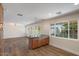 Bright living room with breakfast bar, recessed lighting, and natural light from oversized windows at 7254 E Vernon Ave, Scottsdale, AZ 85257