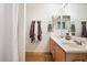 Bathroom featuring double sinks, tile floors, and a shower with a white curtain at 7471 E Desert Vista Rd, Scottsdale, AZ 85255