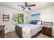 Comfortable bedroom featuring a ceiling fan, a window, and furniture at 7471 E Desert Vista Rd, Scottsdale, AZ 85255