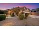 Attractive home showcasing desert landscaping, stone accents, and a welcoming entrance at 7471 E Desert Vista Rd, Scottsdale, AZ 85255