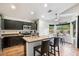 Stylish kitchen with an island, stainless steel appliances, and convenient breakfast bar seating at 7471 E Desert Vista Rd, Scottsdale, AZ 85255