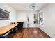 Well-lit home office with a spacious desk and lots of natural light from the large window at 7471 E Desert Vista Rd, Scottsdale, AZ 85255