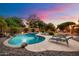 Beautiful pool with a rock feature and lounge chairs, ideal for outdoor relaxation at 7471 E Desert Vista Rd, Scottsdale, AZ 85255