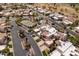Aerial view of neighborhood featuring homes, tree lined streets, tennis courts and community pool at 8100 E Camelback Rd # 138, Scottsdale, AZ 85251