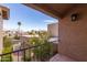 Upward view from a covered balcony that overlooks a courtyard and neighborhood at 8100 E Camelback Rd # 138, Scottsdale, AZ 85251