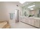 Bright bathroom featuring a double vanity, vessel sinks, and large mirror with great natural lighting at 8100 E Camelback Rd # 138, Scottsdale, AZ 85251