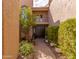 Beautiful outdoor space showcasing lush foliage, with a brick pathway leading up to the front door at 8100 E Camelback Rd # 138, Scottsdale, AZ 85251