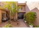 Charming courtyard featuring a serene outdoor seating area, lush greenery, and a brick pathway at 8100 E Camelback Rd # 138, Scottsdale, AZ 85251
