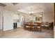 Bright dining room featuring hardwood floors, wine storage, and a chandelier at 8100 E Camelback Rd # 138, Scottsdale, AZ 85251