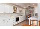 Spacious kitchen with white cabinets, quartz countertops, and stainless appliances at 8100 E Camelback Rd # 138, Scottsdale, AZ 85251