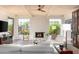 Inviting living room showcasing fireplace, beamed ceiling, and natural light at 8100 E Camelback Rd # 138, Scottsdale, AZ 85251