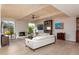 Cozy living room with beamed ceilings, fireplace, and comfortable seating at 8100 E Camelback Rd # 138, Scottsdale, AZ 85251
