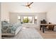 Bright and airy main bedroom with a bay window and a workspace illuminated by natural light at 8100 E Camelback Rd # 138, Scottsdale, AZ 85251