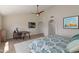 Large main bedroom with modern decor, wooden floors, a work space, and large closet doors at 8100 E Camelback Rd # 138, Scottsdale, AZ 85251
