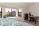 Well-lit main bedroom featuring a bay window, wooden desk, and views to the neighborhood at 8100 E Camelback Rd # 138, Scottsdale, AZ 85251