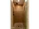 Updated shower with stone tile, glass door, modern fixtures, and a built-in shelf at 8100 E Camelback Rd # 138, Scottsdale, AZ 85251