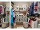 Well-organized walk-in closet with ample shelving and storage solutions for clothing and accessories at 8100 E Camelback Rd # 138, Scottsdale, AZ 85251