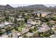 Wide aerial home view showing putting green, tennis court and swimming pool at 8817 N 58Th Pl, Paradise Valley, AZ 85253