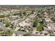Expansive aerial view of estate with golf course, mature trees, and neighboring homes at 8817 N 58Th Pl, Paradise Valley, AZ 85253