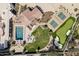 Expansive estate features a pool, putting green, pickleball court, and lush landscaping, creating an outdoor oasis at 8817 N 58Th Pl, Paradise Valley, AZ 85253