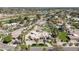 Aerial view reveals desert landscaping, neighborhood, surrounding desert area, and serene atmosphere at 8817 N 58Th Pl, Paradise Valley, AZ 85253