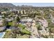 Aerial view of sprawling home, with a pool, pickleball court, and a putting green at 8817 N 58Th Pl, Paradise Valley, AZ 85253