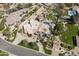 Aerial view of luxurious home showing circular driveway and well manicured landscape at 8817 N 58Th Pl, Paradise Valley, AZ 85253