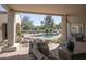 Spacious covered patio provides lovely views of the pool, garden, and outdoor seating area at 8817 N 58Th Pl, Paradise Valley, AZ 85253