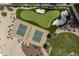 Aerial view of backyard amenities with pickleball court, sand trap and putting green at 8817 N 58Th Pl, Paradise Valley, AZ 85253