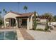Inviting outdoor space with pool, outdoor kitchen, covered patio and lush landscaping at 8817 N 58Th Pl, Paradise Valley, AZ 85253