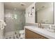 Bathroom showcasing tiled shower, modern fixtures, and stylish vanity area at 8817 N 58Th Pl, Paradise Valley, AZ 85253