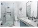 Contemporary bathroom featuring a glass shower, gray tile, and modern fixtures, offering a sleek design at 8817 N 58Th Pl, Paradise Valley, AZ 85253