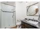 Bathroom featuring a glass-enclosed shower, marble vanity, and sleek fixtures at 8817 N 58Th Pl, Paradise Valley, AZ 85253