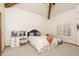 Cozy bedroom featuring wood beams, a ceiling fan, and a writing desk, offers a comfortable retreat at 8817 N 58Th Pl, Paradise Valley, AZ 85253
