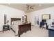 Large bedroom with wood details, a king bed, and an office area, creates a functional and stylish space at 8817 N 58Th Pl, Paradise Valley, AZ 85253