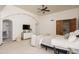 Bright bedroom with a ceiling fan, a desk, and an arched entry provides a relaxing atmosphere at 8817 N 58Th Pl, Paradise Valley, AZ 85253