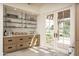 Stylish bar area with open shelving, cabinetry and easy access to the outside patio at 8817 N 58Th Pl, Paradise Valley, AZ 85253